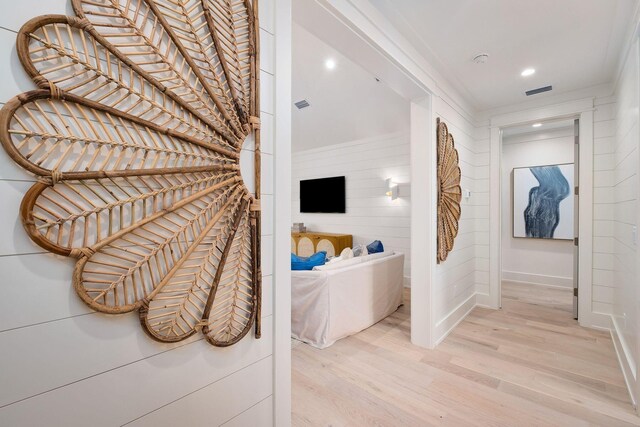 hallway with light hardwood / wood-style flooring