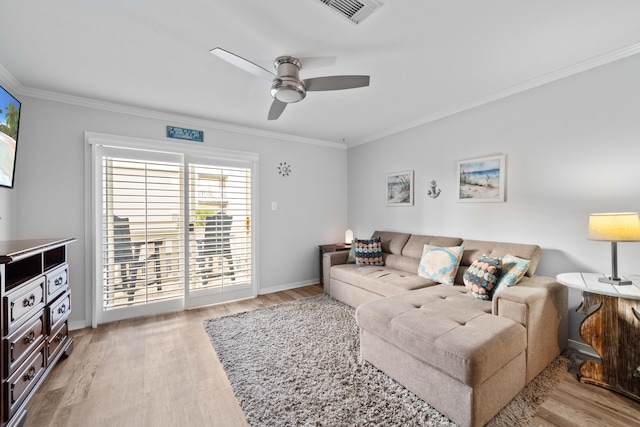 living room featuring ceiling fan, light hardwood / wood-style floors, and ornamental molding