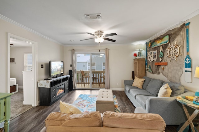 living room with ceiling fan, dark hardwood / wood-style flooring, and ornamental molding