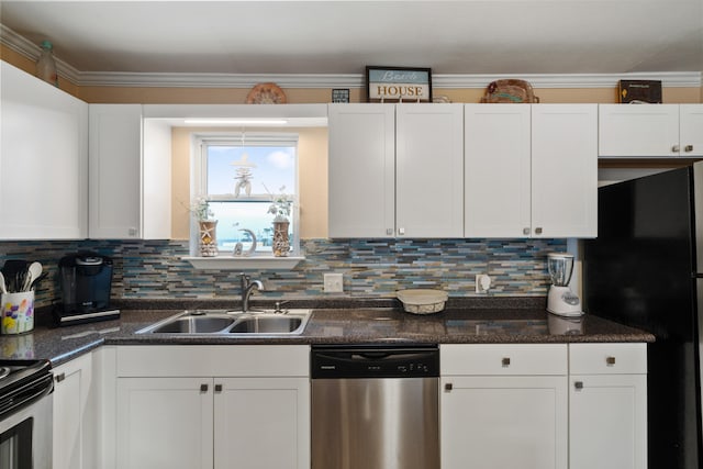 kitchen featuring white cabinets, sink, ornamental molding, appliances with stainless steel finishes, and tasteful backsplash