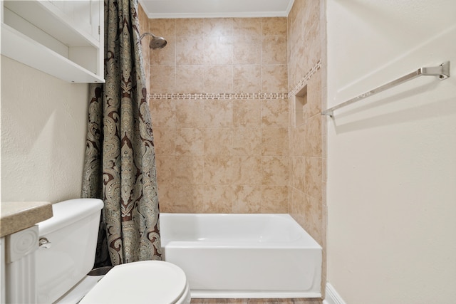 bathroom with shower / bath combo, toilet, and ornamental molding