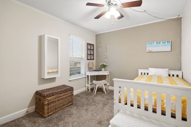 carpeted bedroom with ceiling fan and ornamental molding