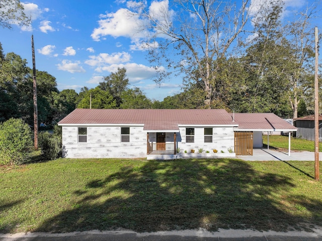 ranch-style home with a front yard and a carport