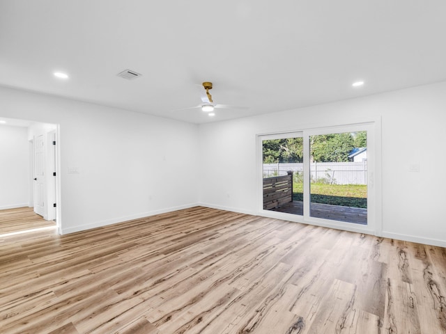 spare room with ceiling fan and light hardwood / wood-style flooring