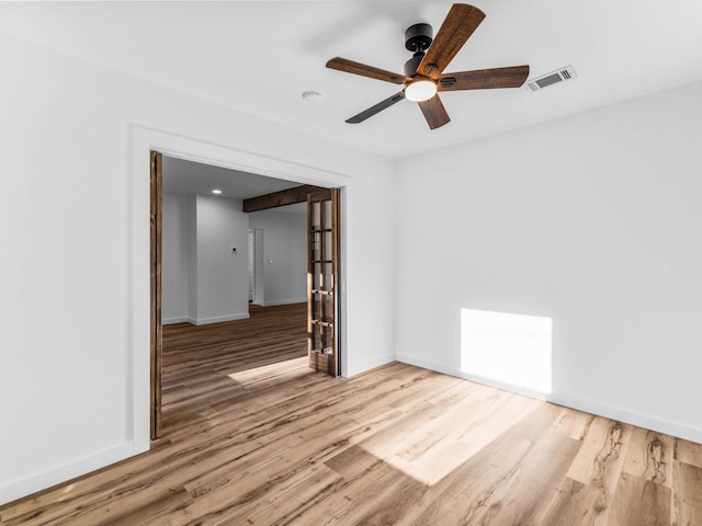 274 S 20th St, Defuniak Springs, FL 32435 - unfurnished room with wood finished floors, a ceiling fan, and baseboards