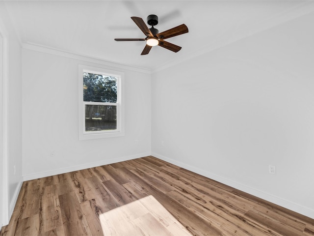 spare room with hardwood / wood-style flooring, ceiling fan, and ornamental molding