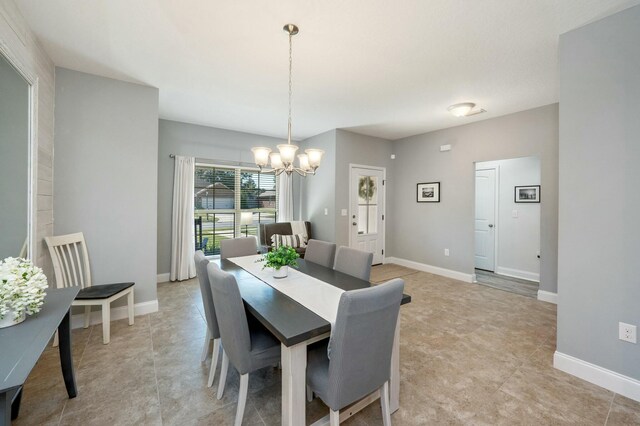 dining room with a chandelier