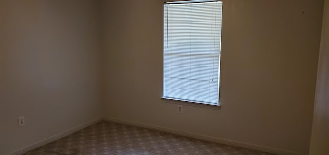 spare room with light colored carpet