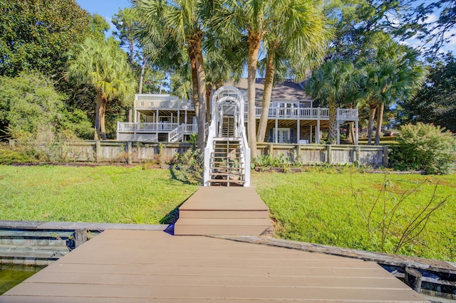 view of dock featuring a yard