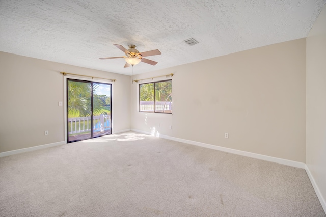 unfurnished room with carpet, a textured ceiling, and ceiling fan