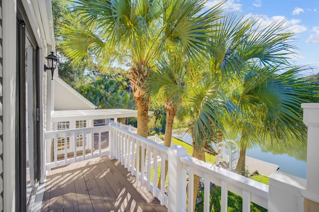 wooden deck with a water view