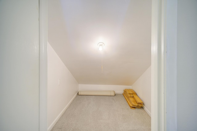 bonus room featuring light colored carpet and lofted ceiling