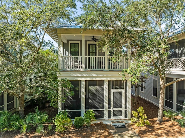 rear view of house with a balcony