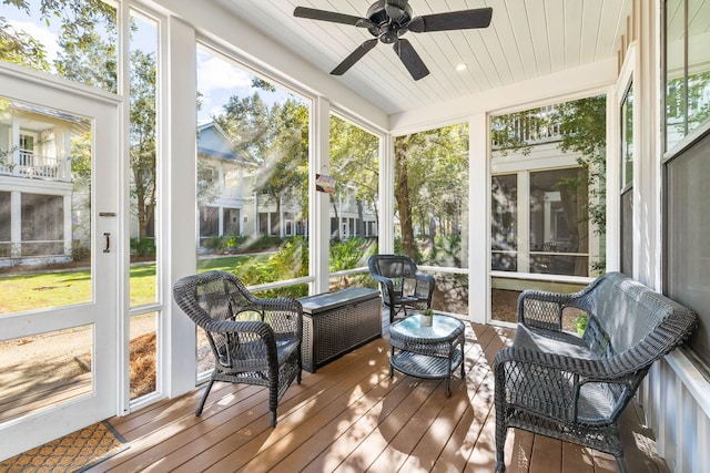 sunroom featuring ceiling fan