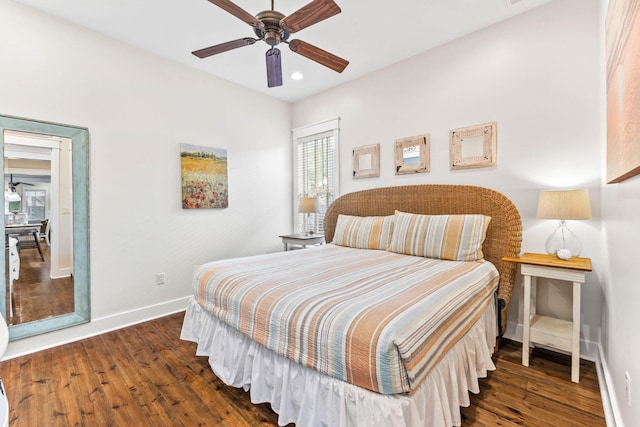 bedroom featuring ceiling fan and dark wood-type flooring