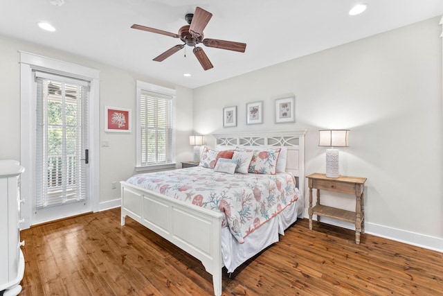 bedroom with ceiling fan, dark hardwood / wood-style flooring, and access to outside