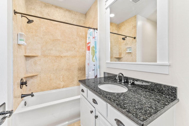 bathroom with vanity and shower / bath combo