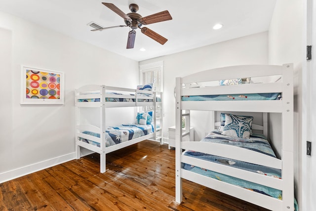 bedroom featuring hardwood / wood-style flooring and ceiling fan