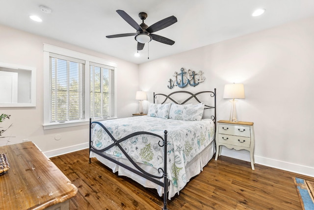 bedroom featuring dark hardwood / wood-style flooring and ceiling fan