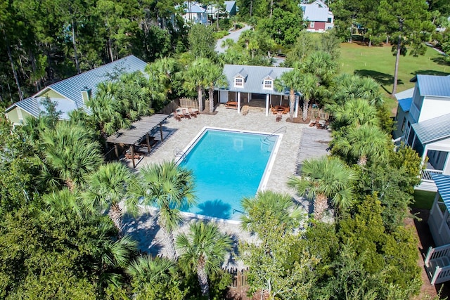 view of swimming pool with a patio area and a pergola