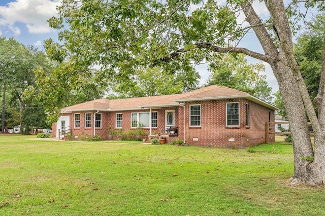 single story home with a front yard