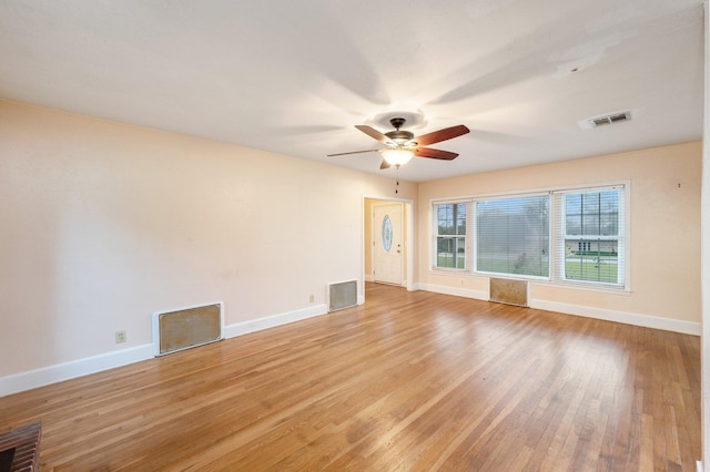 empty room featuring ceiling fan and light hardwood / wood-style floors