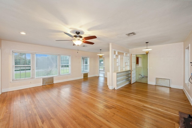 spare room featuring wood-type flooring and ceiling fan