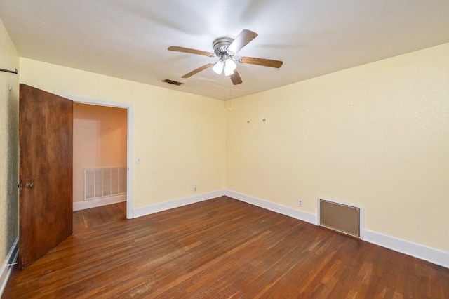 unfurnished room with ceiling fan and dark hardwood / wood-style floors