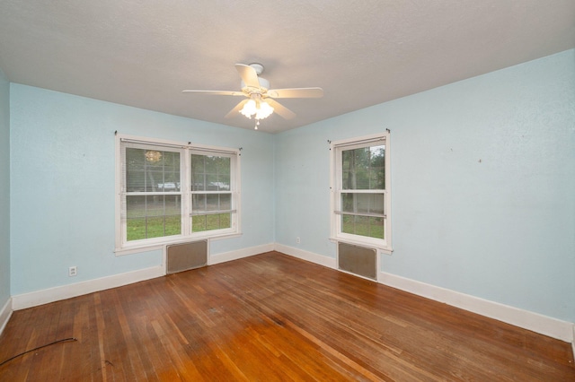 unfurnished room featuring ceiling fan and hardwood / wood-style floors