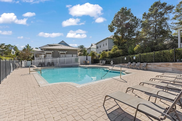 view of swimming pool with a patio