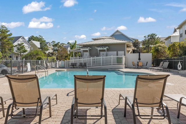 view of swimming pool with a patio