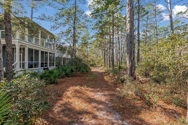 view of yard featuring a sunroom