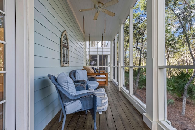 sunroom featuring ceiling fan