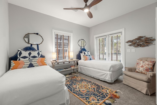 carpeted bedroom featuring ceiling fan and access to exterior