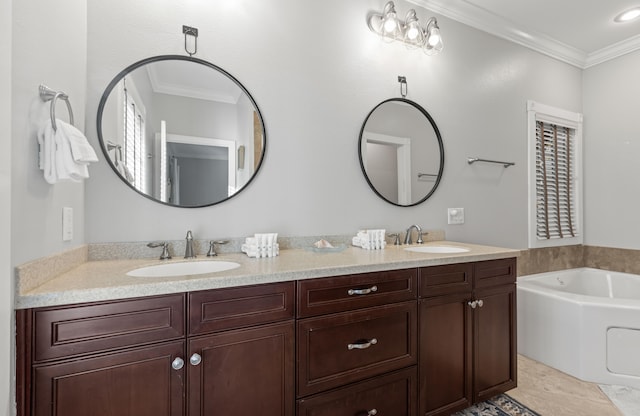 bathroom with vanity, a tub to relax in, and crown molding