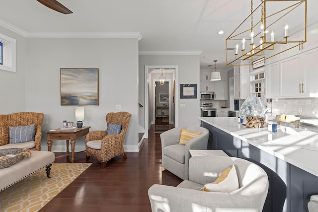 living room with dark hardwood / wood-style flooring and crown molding