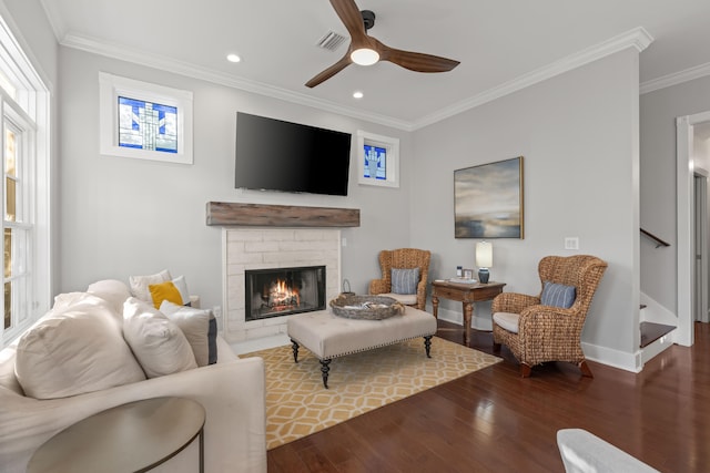 living room featuring ceiling fan, dark hardwood / wood-style flooring, and crown molding