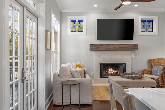 living room featuring ceiling fan, dark hardwood / wood-style flooring, ornamental molding, and french doors