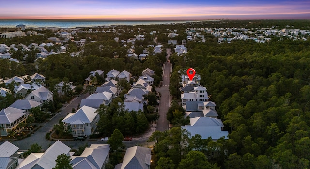 aerial view at dusk with a water view