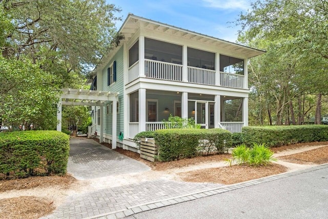 view of front of home featuring a pergola and a sunroom