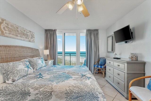 tiled bedroom featuring access to exterior and ceiling fan