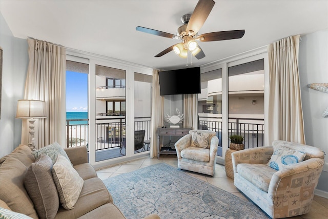 tiled living room featuring ceiling fan