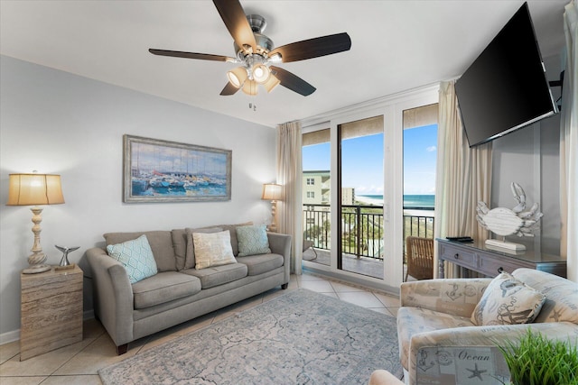 tiled living room featuring ceiling fan