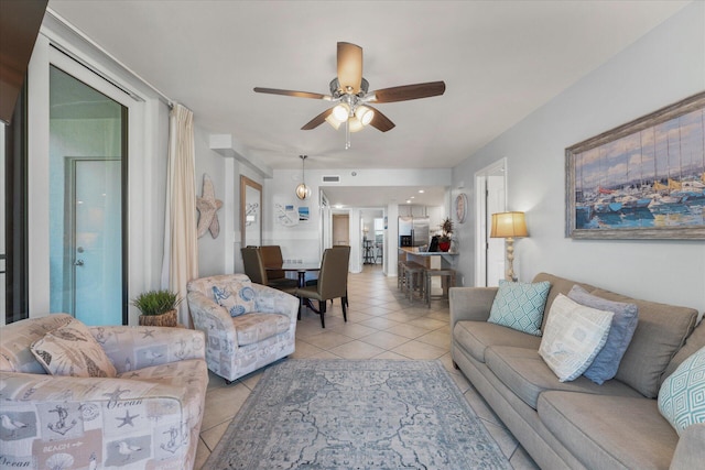 living room with light tile patterned floors and ceiling fan