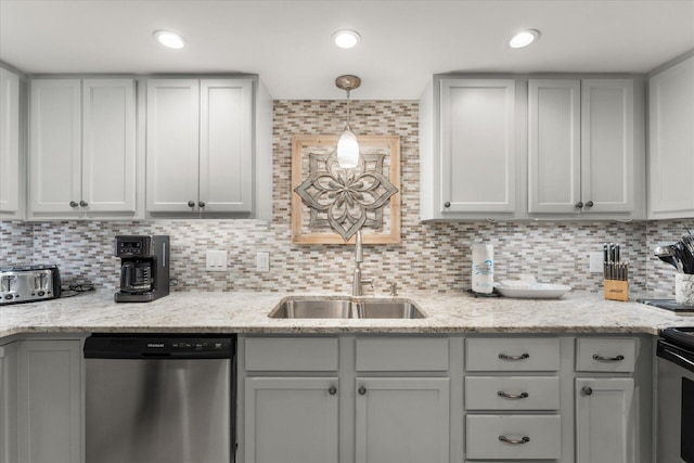 kitchen featuring stainless steel dishwasher, decorative backsplash, and sink