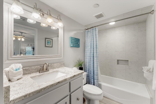 full bathroom featuring shower / bath combo, vanity, ceiling fan, toilet, and wood-type flooring