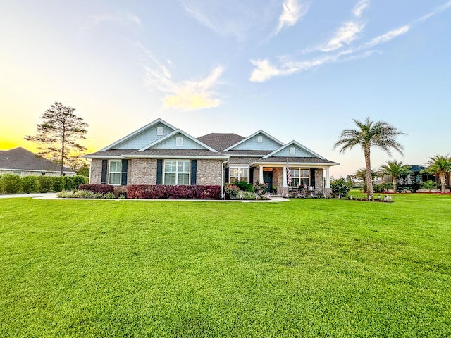 624 Tournament Ln, Freeport, FL 32439 - craftsman inspired home featuring a lawn, a porch, and brick siding