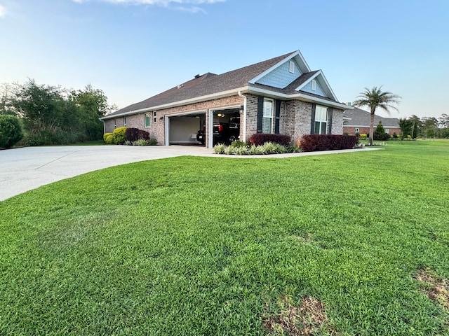 view of front of property featuring a garage and a front lawn