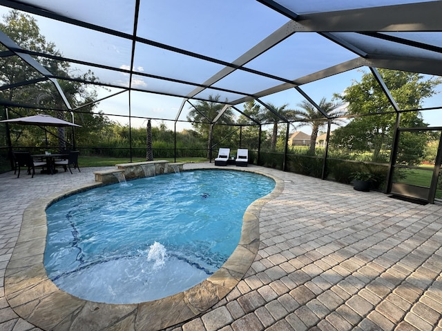 624 Tournament Ln, Freeport, FL 32439 - outdoor pool featuring a patio area and glass enclosure
