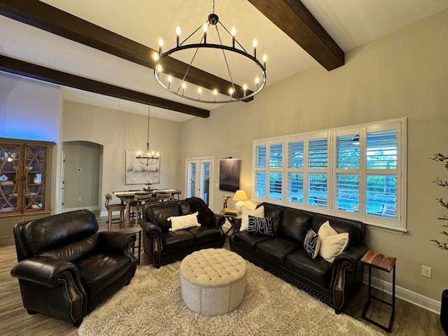 living room featuring hardwood / wood-style floors, beamed ceiling, and a notable chandelier